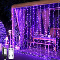 JMEXSUSS 300LED Purple Christmas Lights with Remote, Curtain Hanging Light Plug in, 8 Modes Purple String Lights for Bedroom Window Wall Party Backdrop Halloween Christmas Decorations